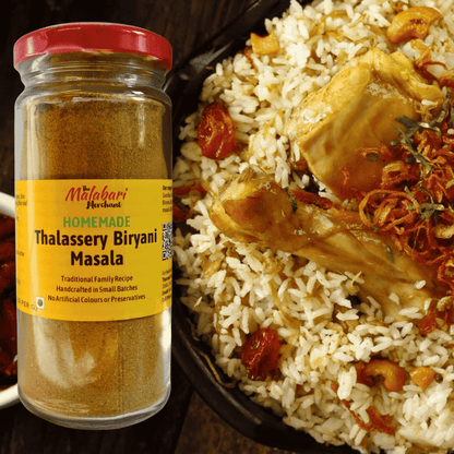 Jar of The Malabari Merchant Homemade Thalassery Biryani Masala next to a plate of biryani.